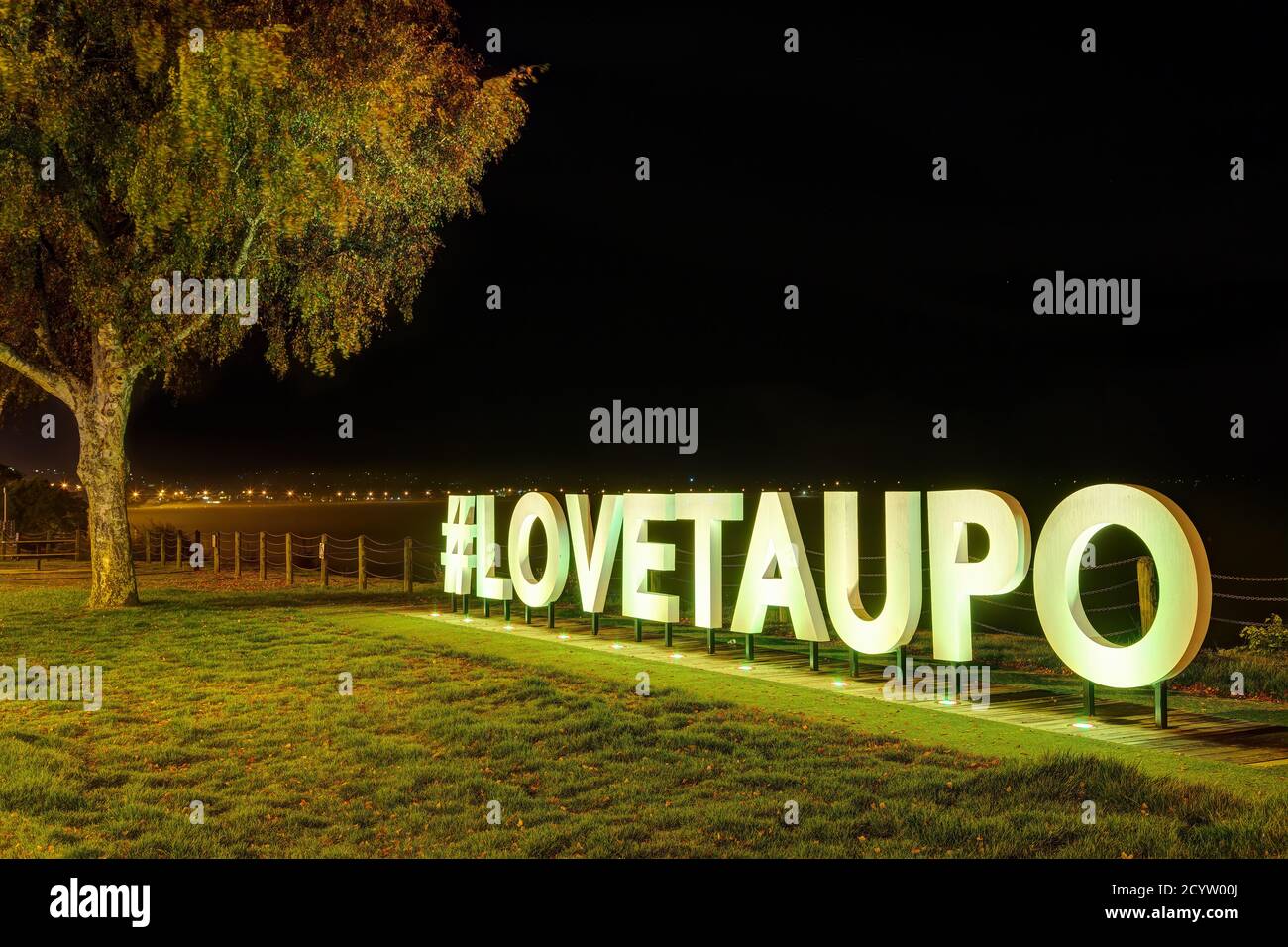 Iluminated '#LOVETAUPO' sign for tourists on the shore of Lake Taupo, New Zealand Stock Photo