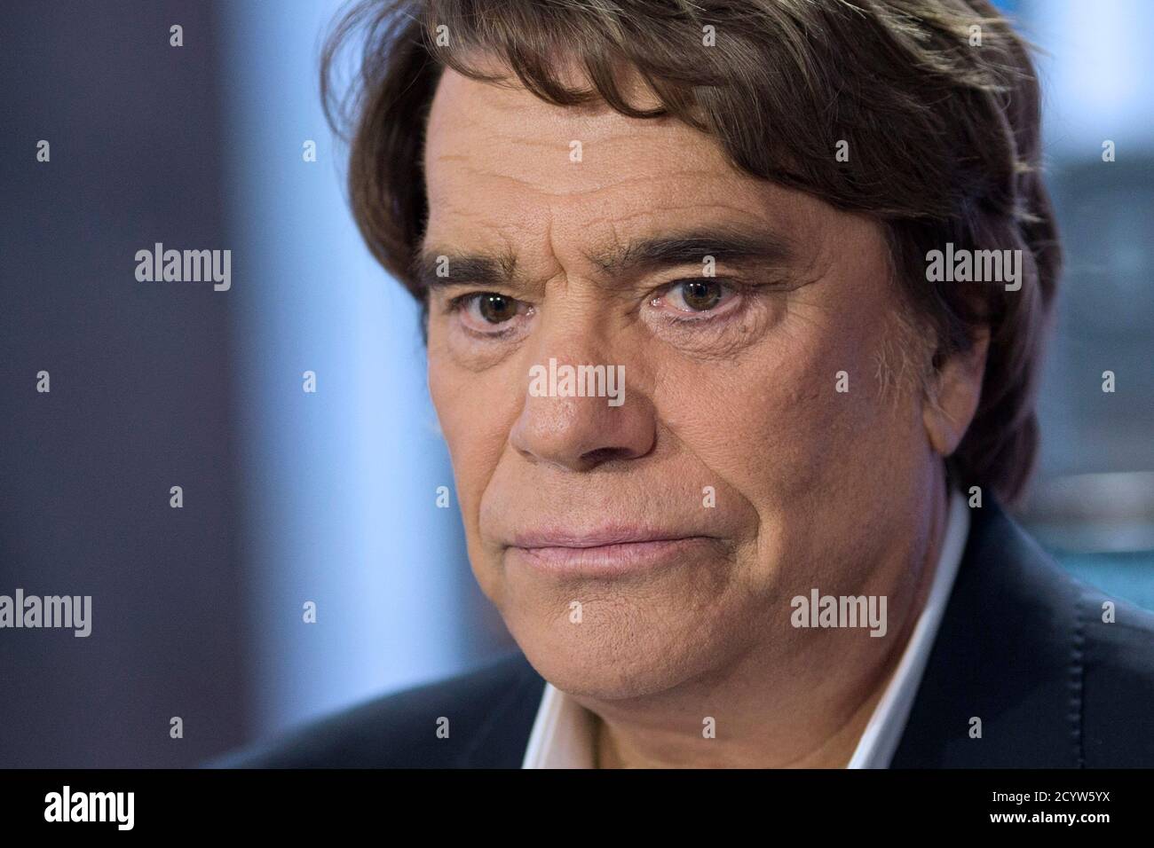 French businessman Bernard Tapie attends the French channel France 2 news  evening broadcast in Paris July 1, 2013. Tapie was put under formal  investigation on suspicion of fraud on Friday in connection