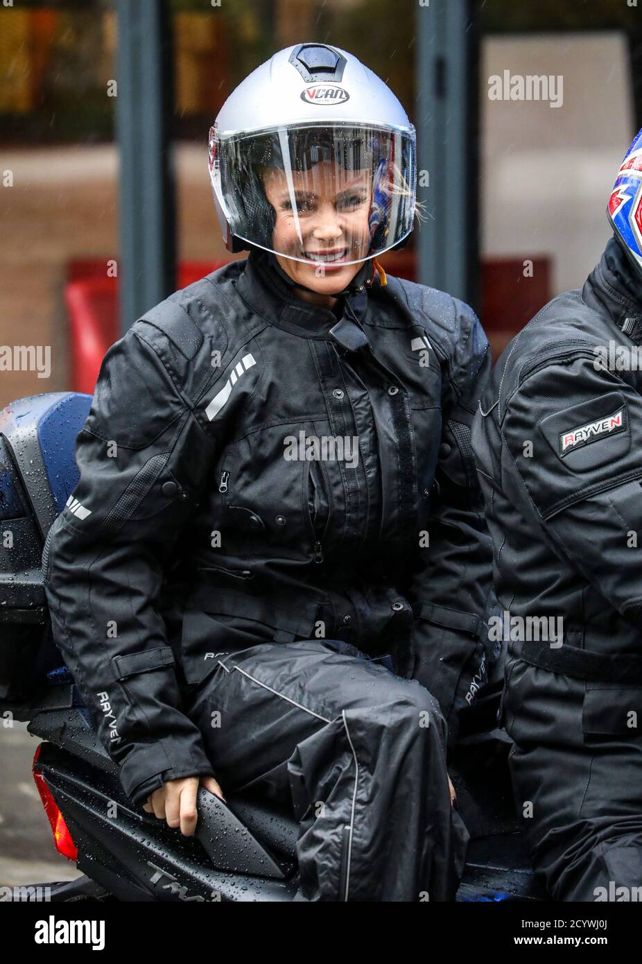 Amanda Holden seen departs the Global Radio Studios on a bike during a