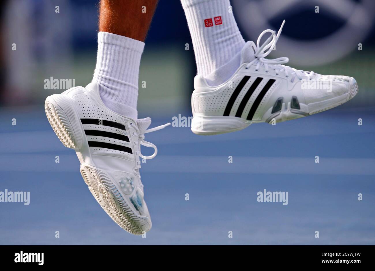 Shoes of Novak Djokovic of Serbia are pictured as he plays a shot against  David Ferrer of Spain during their men's singles semifinals match at the  U.S. Open tennis tournament in New