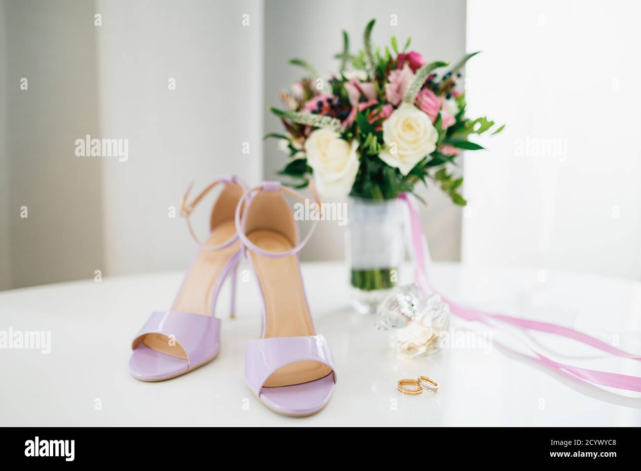 wedding rings and a bouquet of flowers 