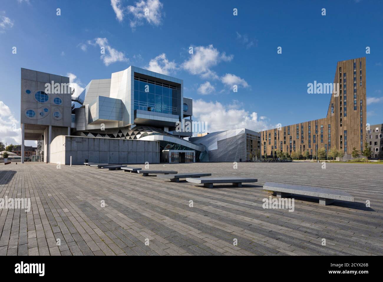 Aalborg, Denmark – September 4, 2020: Musikkens Hus, multifunctional venue with concert halls and rehearsal rooms,  Studentertorvet building in backgr Stock Photo