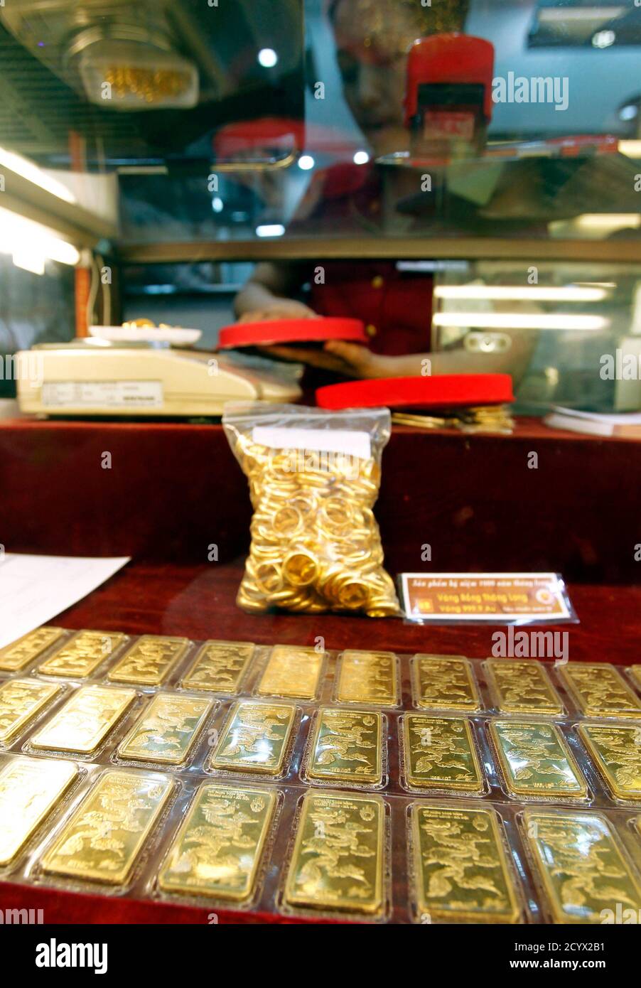 Gold bars are displayed for sale at a gold shop in Hanoi August 23, 2011.  Vietnam's central bank has authorised at least one domestic firm to import  more gold to help cool