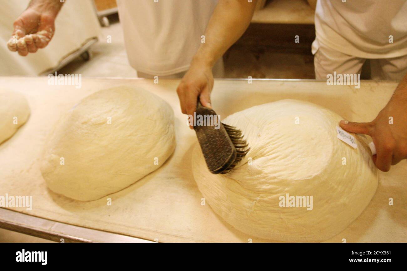 A Baker Prepares Bread For Baking In The Lipoti Bakery In Budapest November 3 2011 The Lipoti Bakery Started As A Small Family Venture In 1992 In Lipot Western Hungary And Grew