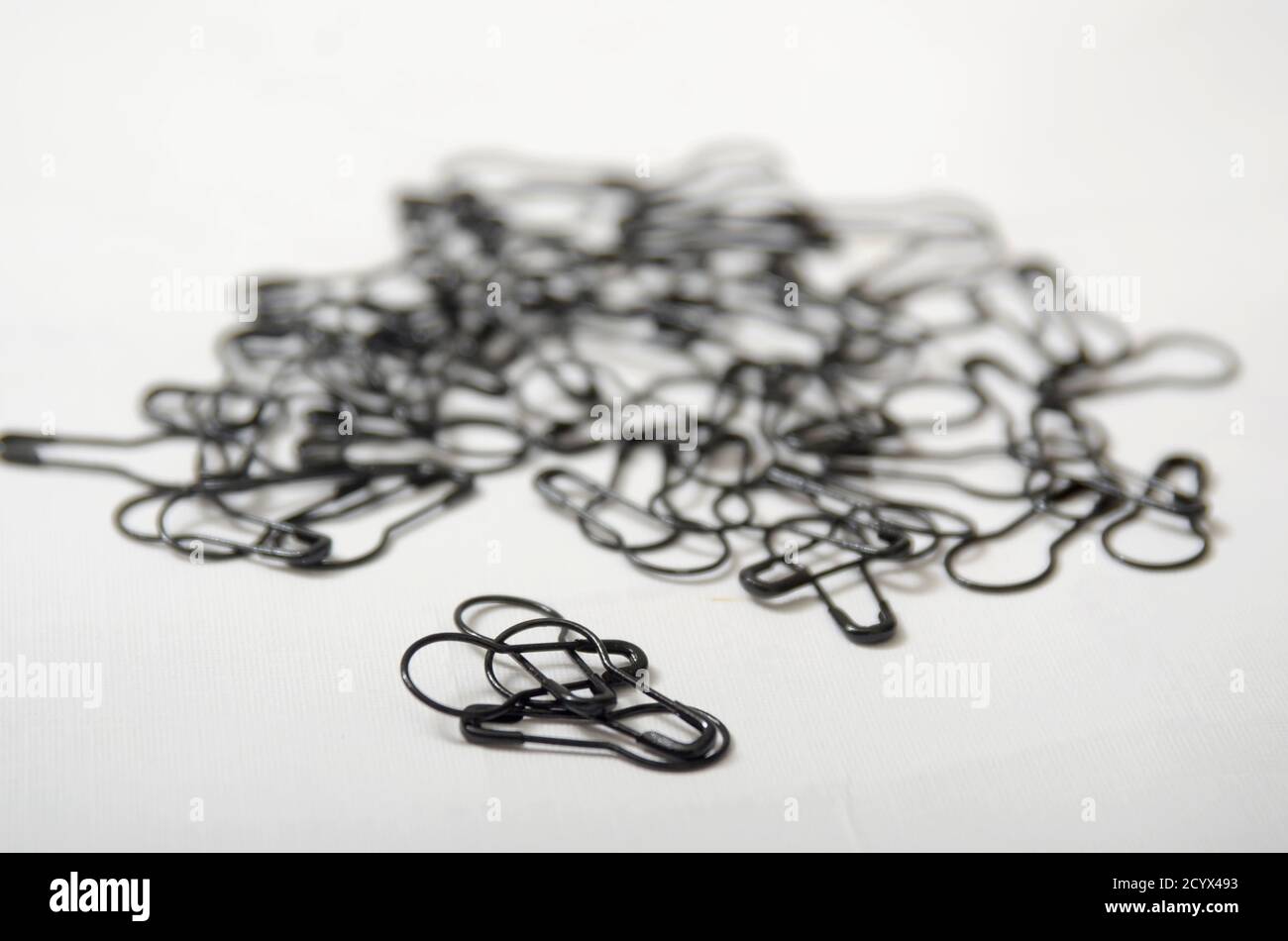 group of Small Black Safety Pin Isolated on White Stock Photo Alamy