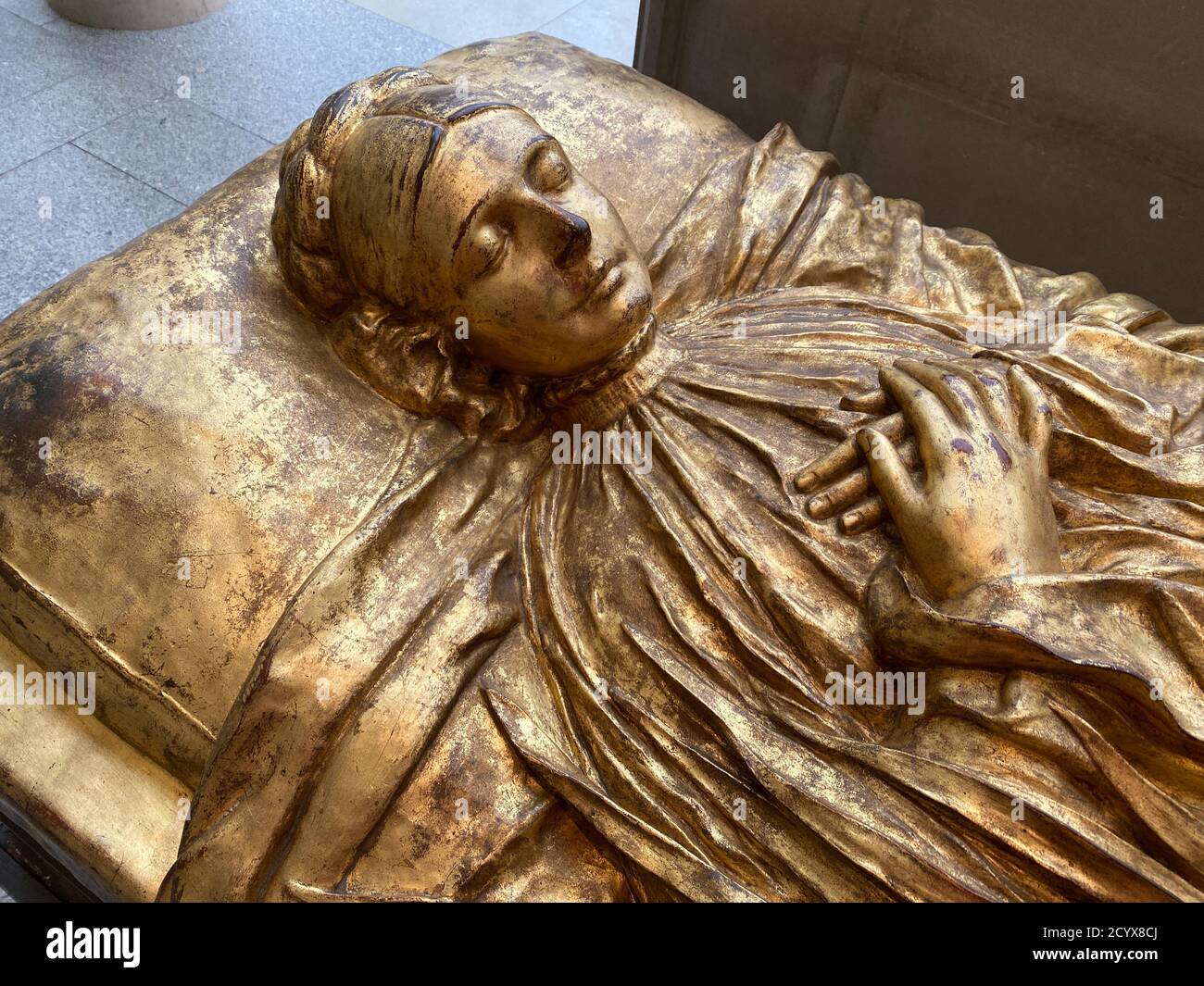 Tomb effigy of Elizabeth Boott Duveneck, 1891, this cast 1927, Gilt Bronze. After her death her bereaved husband the painter Frank Duveneck modeled a poignant funery monument reminiscent of Gothic and Renaissance tomb effigies. Metropolitan Museum of Art; American Wing. Stock Photo