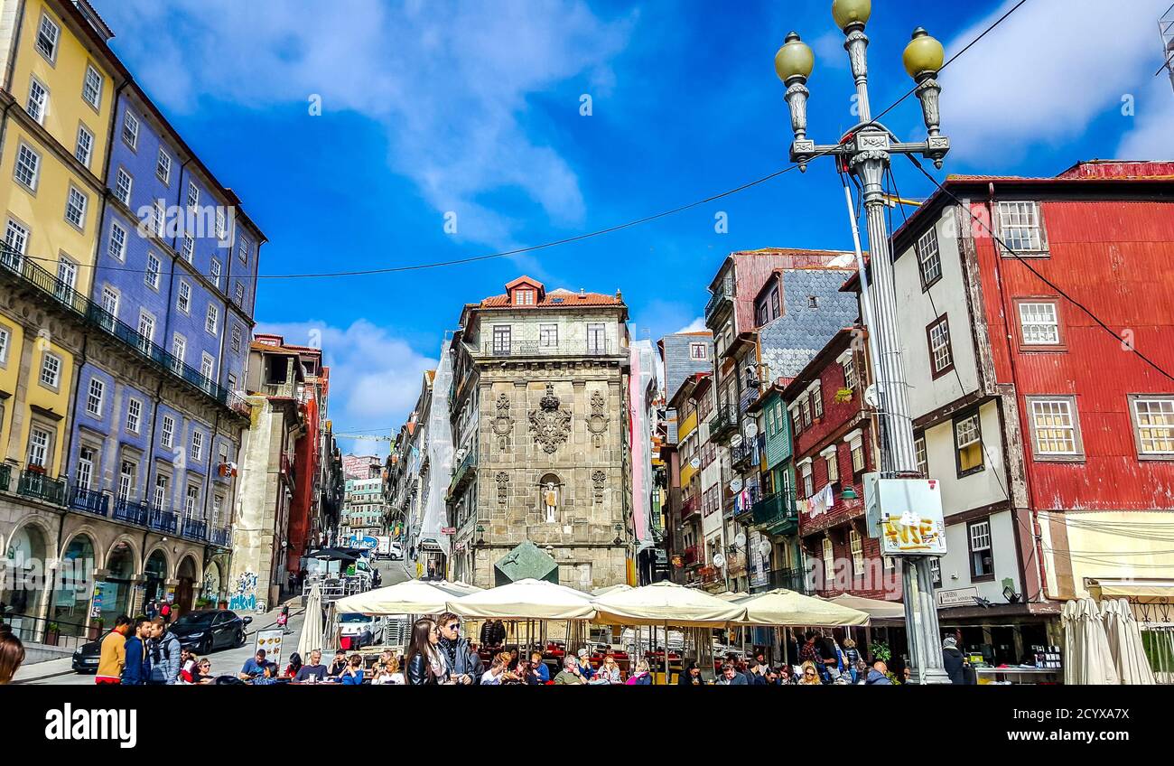 Tourists in street cafe at Ribeira embankment (Cais da Ribeira). Porto, Portugal Stock Photo