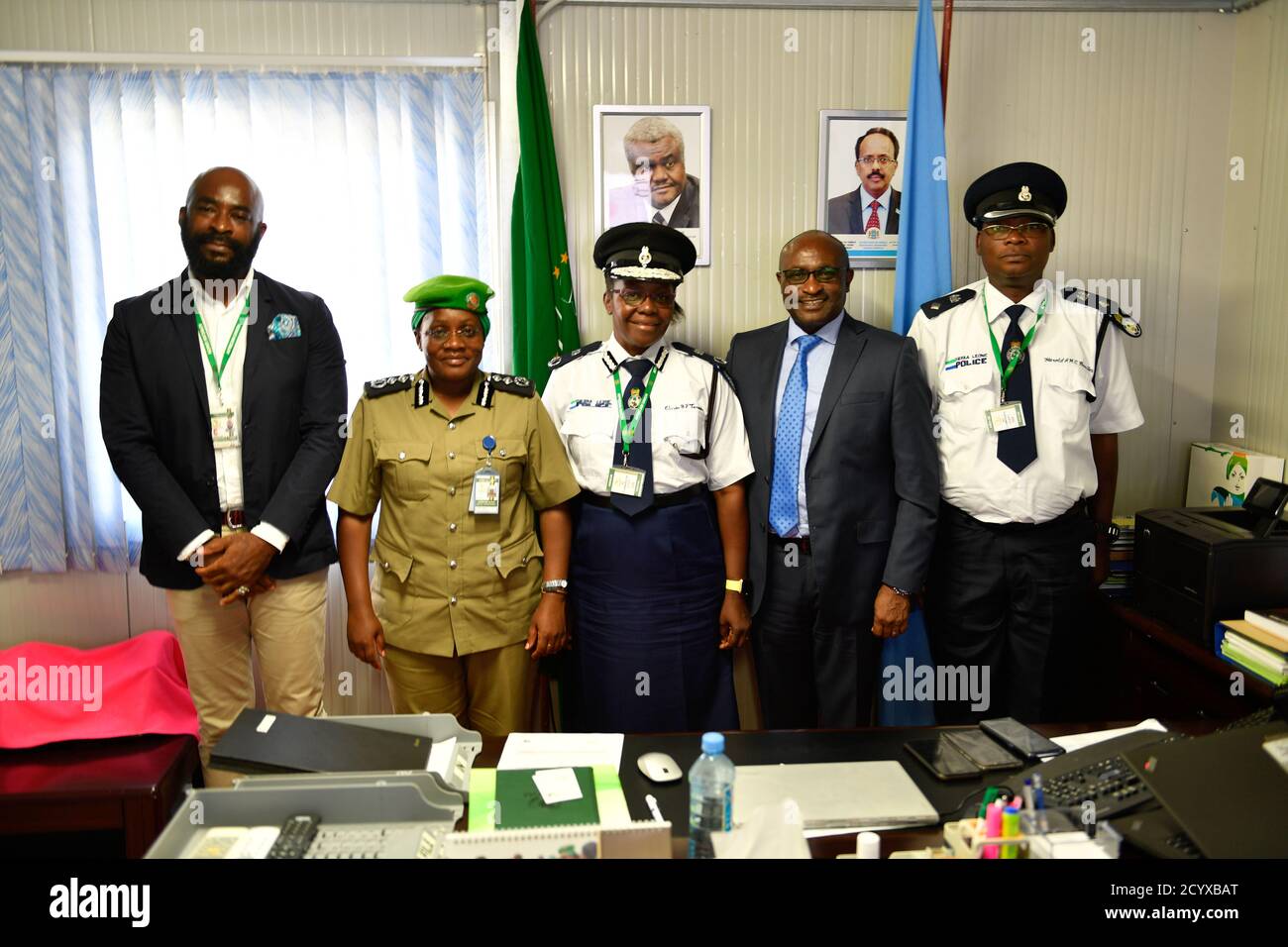 Deputy SRCC, Simon Mulongo, stands with Assistant Inspector General of Police, Gloria Tarawally, and Acting Police Commisioner, Christine Alalo, at the AMISOM headquarters in Mogadishu, Somalia, on 28 September 2018. Stock Photo