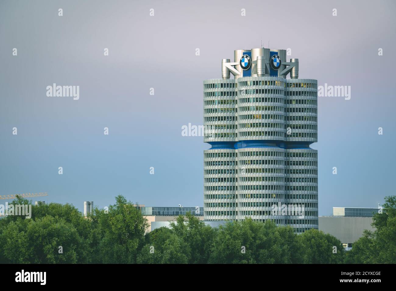 MUNICH, GERMANY - Sep 01, 2020: BMW headquarters in Munich. Modern skyscraper of the Bavarian automobile company in the evening. Stock Photo