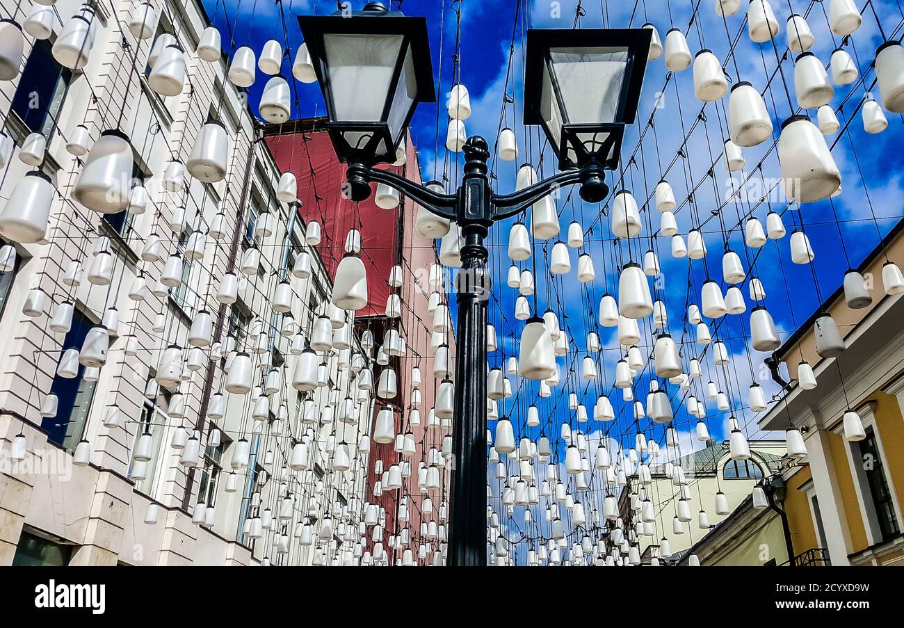 Stoleshnikov lane (Stoleshnikov  Pereulok) decorated with lanterns. Moscow, Russia. Stock Photo