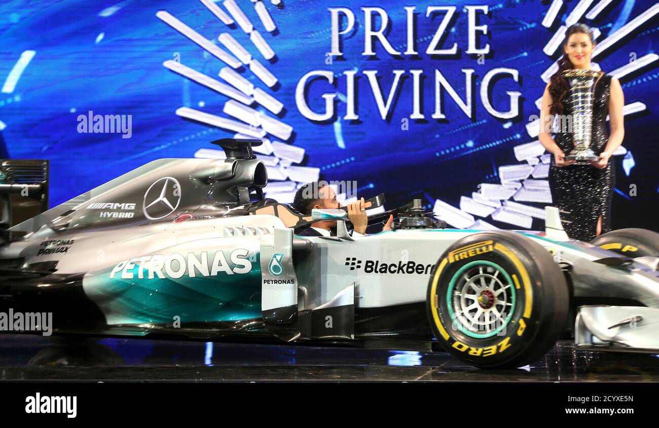 Mercedes Formula One World Champion Lewis Hamilton Britain arrives in his Mercedes car on the podium during the 2014 International Automobile Federation (FIA) Gala Prize-Giving ceremony in December 5,