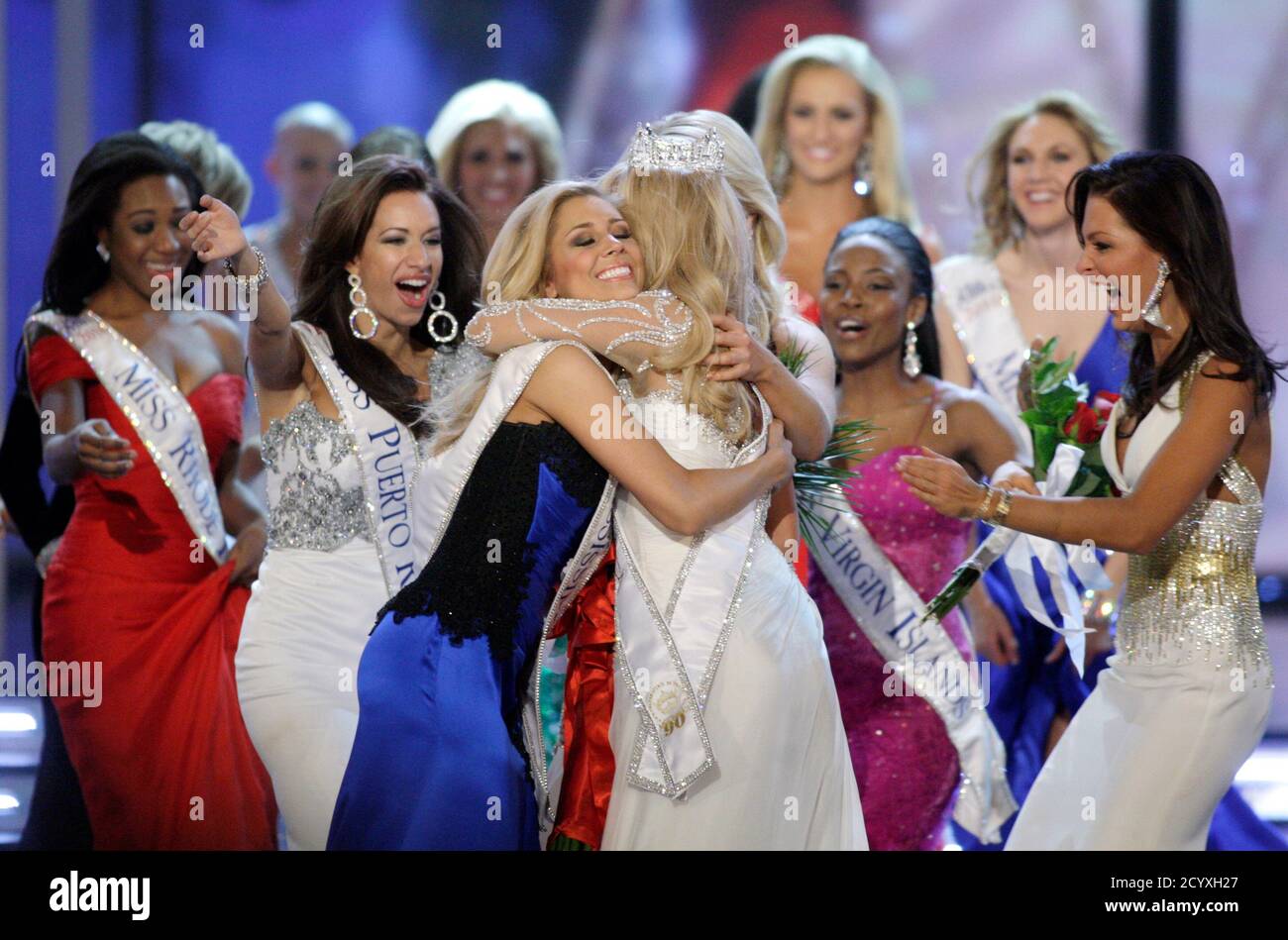 Miss Nebraska Teresa Scanlan (C), 17, is mobbed by other contestants after being crowned Miss America 2011 during the Miss America Pageant at the Theatre for the Performing Arts at the Planet Hollywood Resort & Casino in Las Vegas, Nevada, January 15, 2011. Scanlan was named Miss America on Saturday becoming the youngest winner ever in the pageant's history after a night of being judged for poise, talent, fitness and knowledge.    REUTERS/Steve Marcus (UNITED STATES - Tags: ENTERTAINMENT) Stock Photo