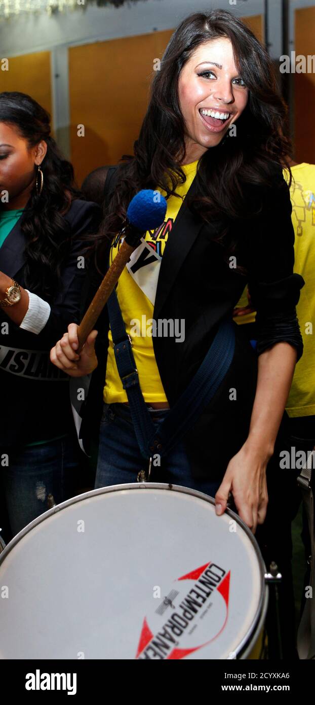 Miss Italy 2011 Elisa Torrini attends a samba drums music class at Meninos  do Morumbi non governmental organization in Sao Paulo August 31, 2011. The  contestants are in Sao Paulo for the