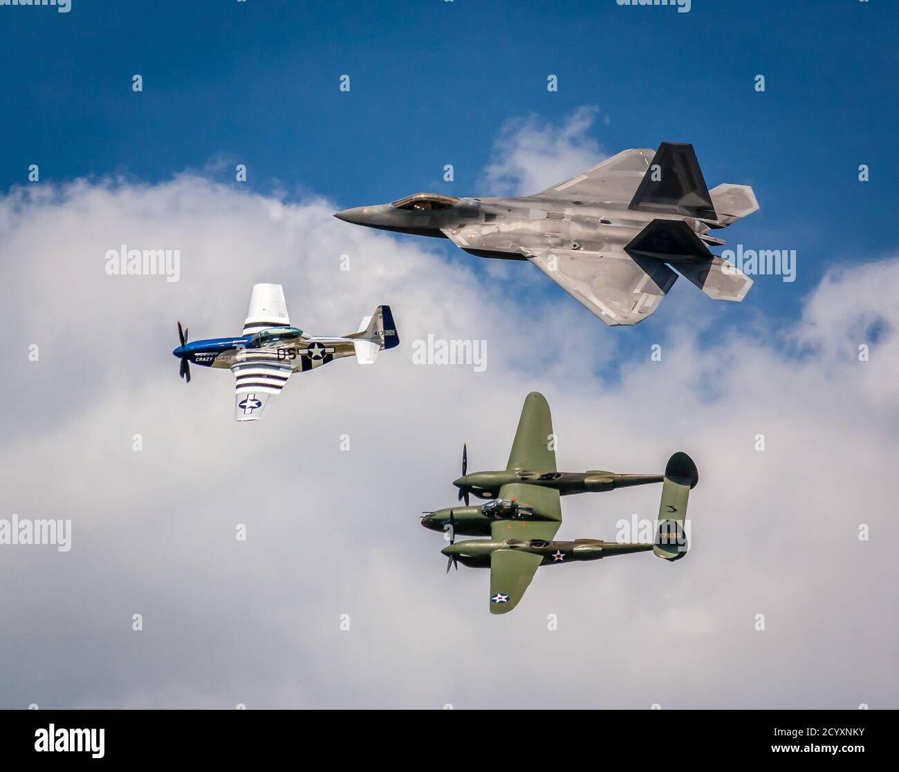LAKELAND, FLORIDA, UNITED STATES - Apr 06, 2014: F22 Raptor, P51 Mustang and P38 Lightning at Sun N' Fun Air Show fly together the Sun and Fun Fly In Stock Photo