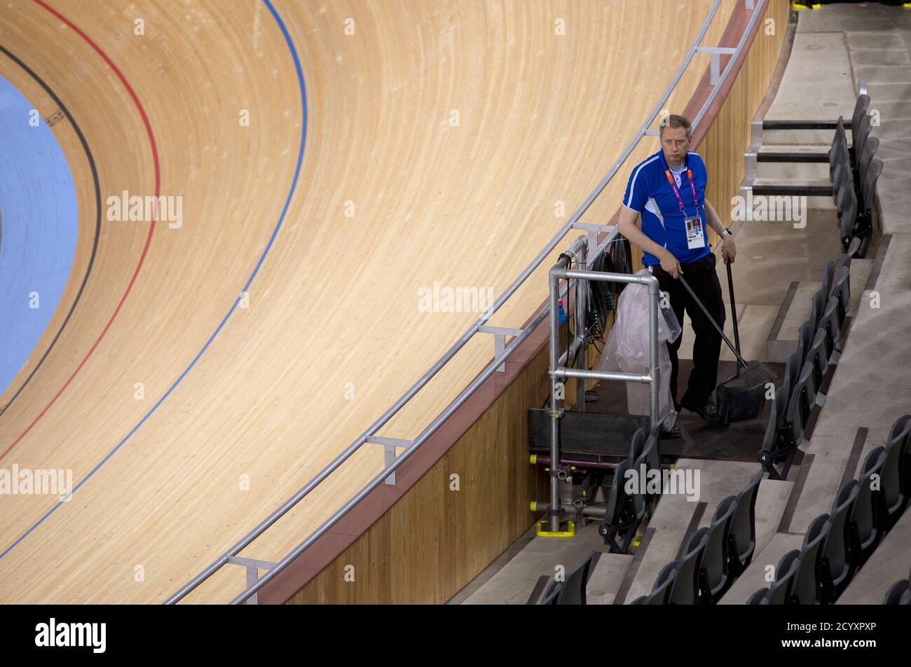 Olympic Workers clean the Velodrome in preparation for athletes at the Olympic Park in Stratford, east London, 19 July 2012 REUTERS/Neil Hall (BRITAIN - Tags: SPORT OLYMPICS CYCLING) Stock Photo