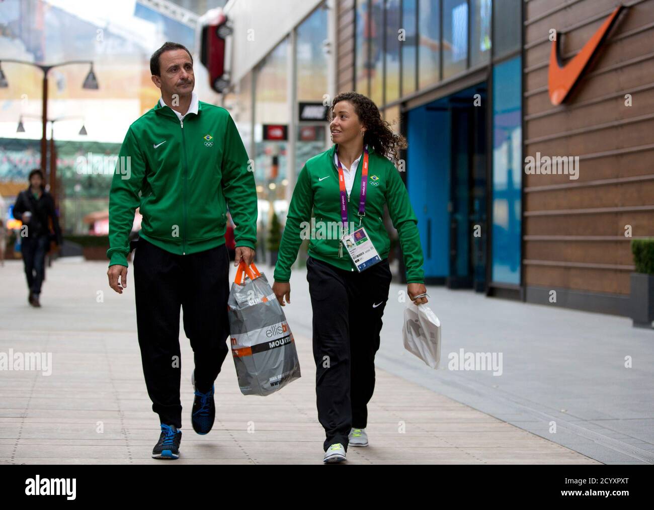 Members of the Brazilian Olympic Team walk in the Westfield Shopping Centre, a major gateway for visitors to the London 2012 Olympic Park, in Stratford, east London, July 19, 2012. REUTERS/Neil Hall (BRITAIN - Tags: SPORT OLYMPICS) Stock Photo