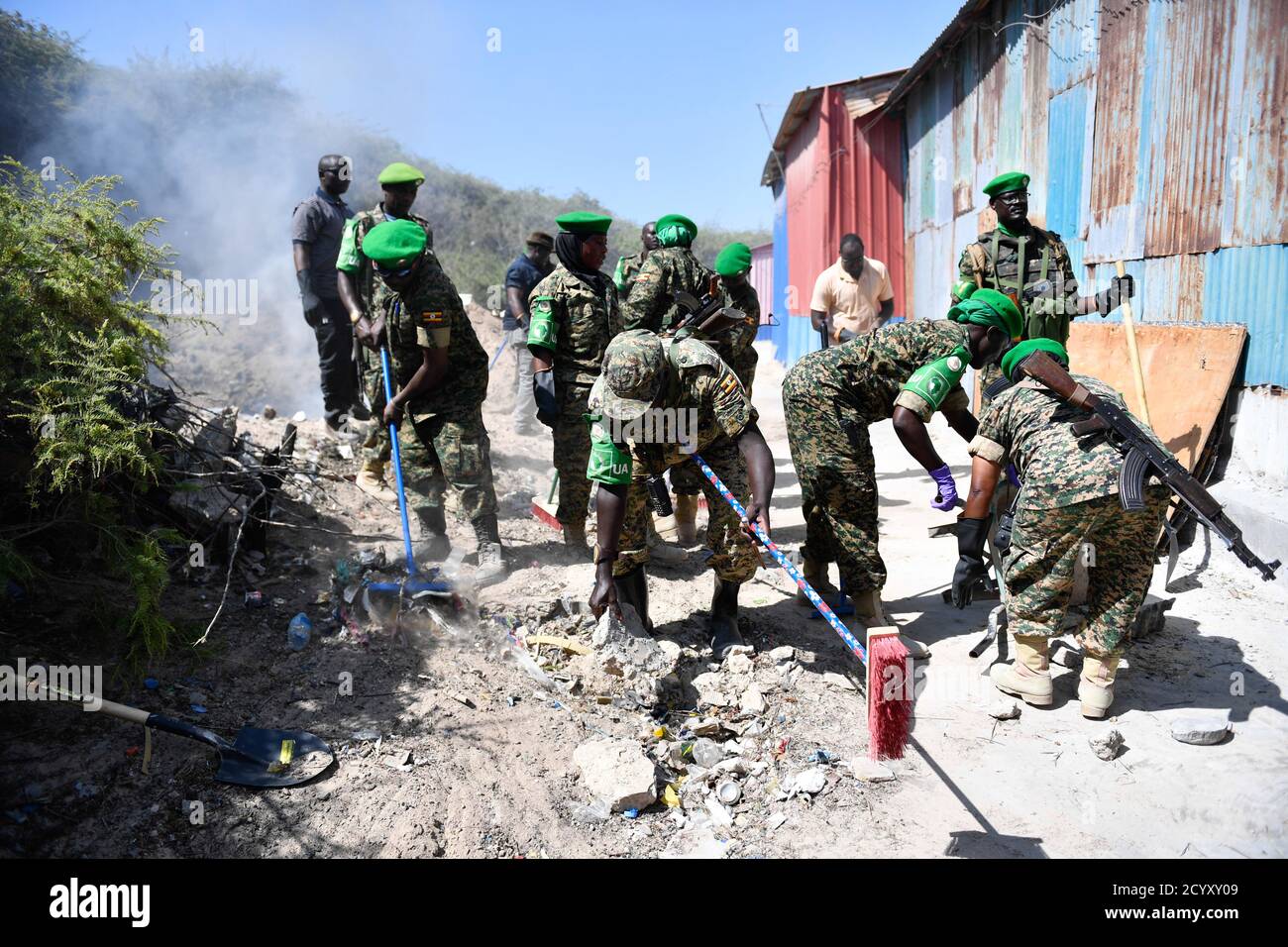 Ugandan soldiers serving under the African Union Mission in Somalia (AMISOM) carry out a community cleanup exercise in Mogadishu, Somalia on February 06, 2019. This was part of activities organised by the Ugandan military to mark 'Tarehe Sita' day in commemoration of the 38th anniversary of the founding of the Uganda People's Defence Forces (UPDF) on 06 February 1981. Stock Photo