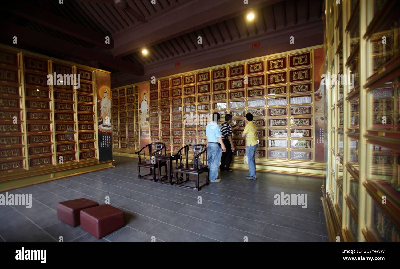 A Family Of Malaysian Ethnic Chinese Visit Their Family Members Columbarium At Nirvana Memorial Park In Shah Alam Outside Kuala Lumpur September 5 2010 Demand For Luxury Funerals Is Booming In Southeast