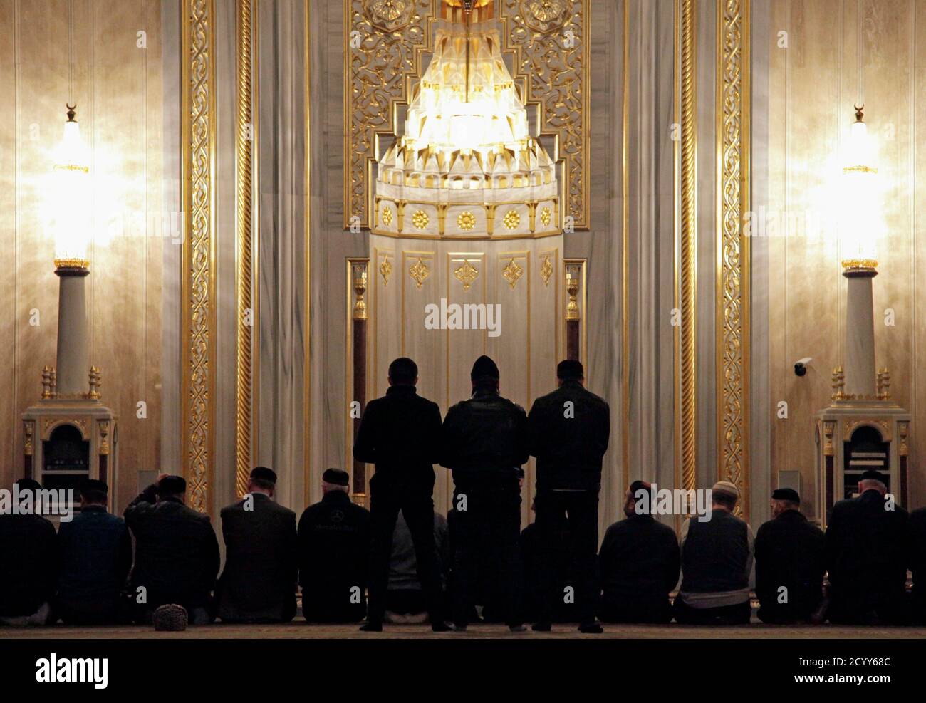 Worshippers perform morning prayers in the central mosque in Grozny March 10, 2011. The central mosque was opened in 2008, a prominent example of the rebuilding of the Chechen capital that was devastated during two separatist wars since 1994. REUTERS/Diana Markosian (RUSSIA - Tags: RELIGION POLITICS) Stock Photo