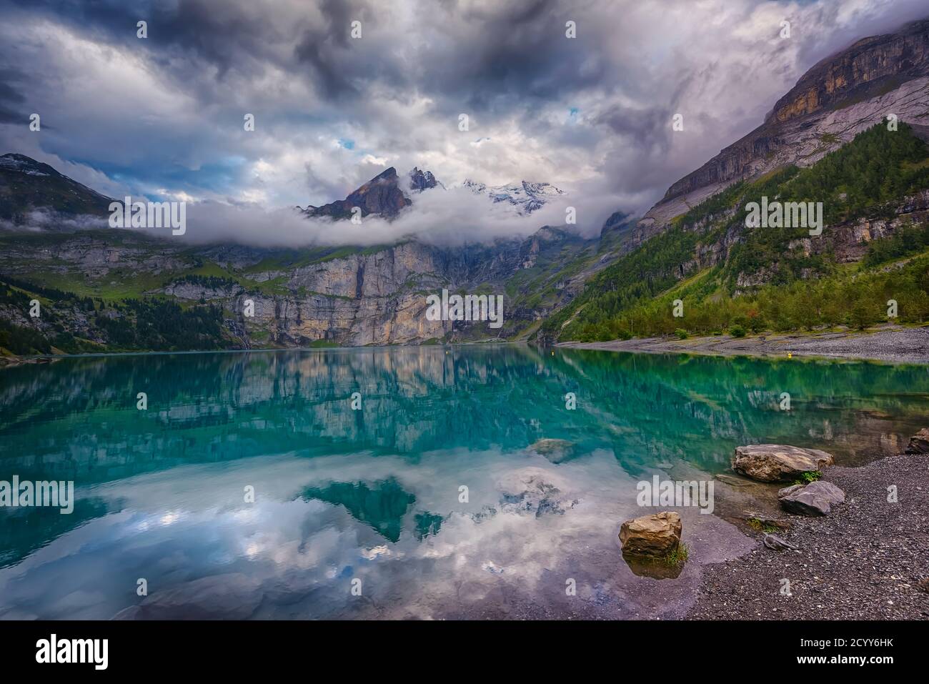 Oschinensee, Kandersteg Switzerland - UNESCO Heritage Sites is a beautiful place for all ages, hiking trail to the lake t is family-friendly. Stock Photo