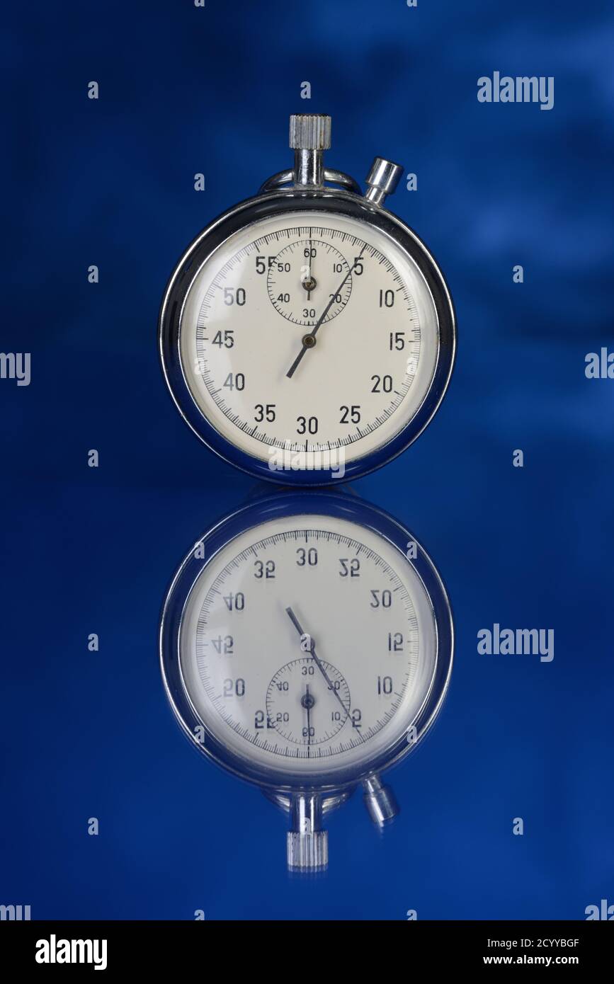 Stopwatch on blue background counted out five seconds Stock Photo