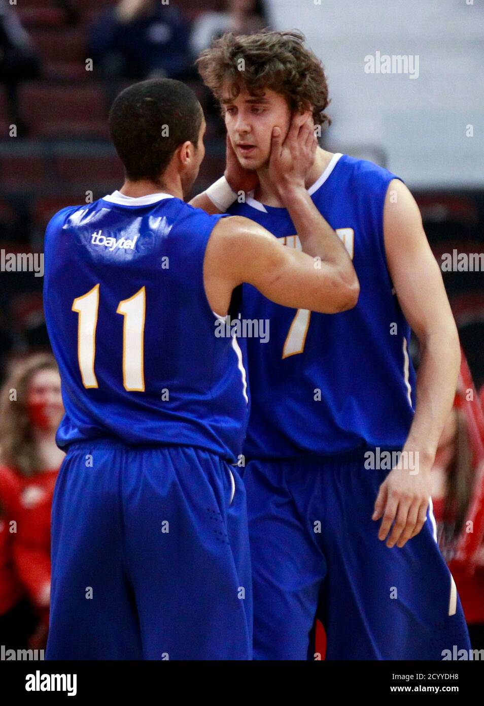 Lakehead Thunderwolves' Ben Johnson (L) speaks with teammate Joseph Nitychoruk during the first half of their Canadian Interuniversity Sport championship basketball game against the Carleton University Ravens in Ottawa March 10, 2013.  REUTERS/Blair Gable (CANADA - Tags: SPORT BASKETBALL) Stock Photo