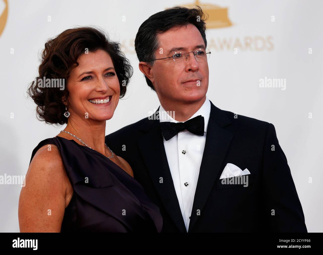 Colbert Report host Stephen Colbert and wife, Evelyn McGee, arrive at the 65th Primetime Emmy Awards in Los Angeles September 22, 2013. REUTERS/Mario Anzuoni (UNITED STATES Tags: ENTERTAINMENT) (EMMYS-ARRIVALS) Stock Photo