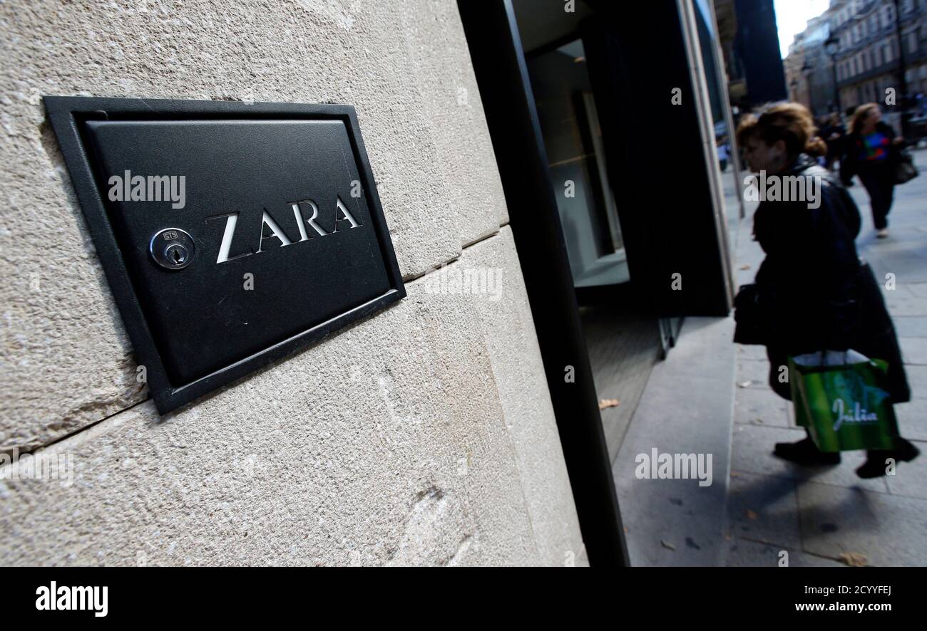 A woman enters a Zara store in Barcelona, November 5, 2013. The world's  largest fashion retailer, Inditex, shows no sign of stalling and investors  are betting that its Zara 