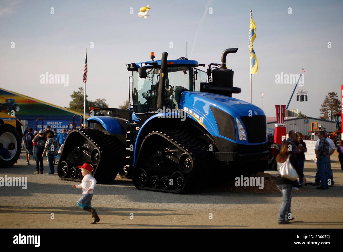 A New Holland T9.700 tractor is exhibited at the 47th Annual World Ag Expo in Tulare, California, February 12, 2014. The expo takes place as a third year of drought plagues California farmers with the driest year on record and prompting California Governor Jerry Brown to declare a statewide drought emergency. Picture taken on February 12, 2014.  REUTERS/David McNew (UNITED STATES - Tags: ENVIRONMENT AGRICULTURE) Stock Photo