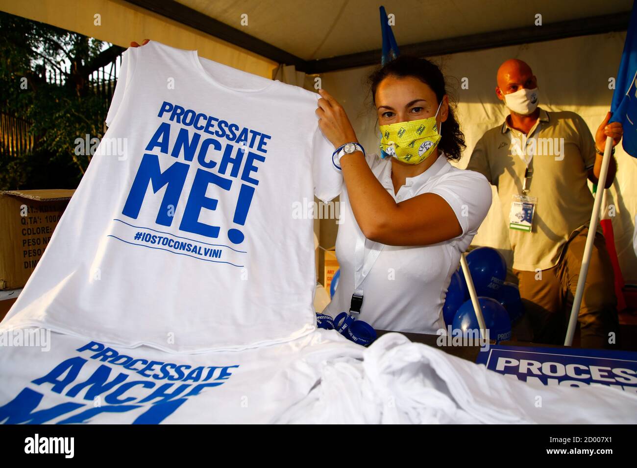 A supporter of Far-right leader Matteo Salvini poses with a T-shirt that  reads "Process me too" as she waits for his arrival to Sicily ahead of the  start of a trial where