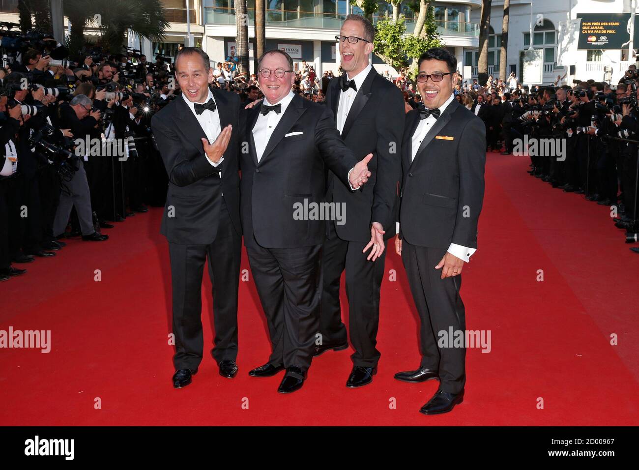 L-R) Producer Jonas Riviera, executive producer John Lasseter, director  Pete Docter and co-director Ronaldo Del Carmen pose on the red carpet as  they arrive for the screening of the animated film "Inside