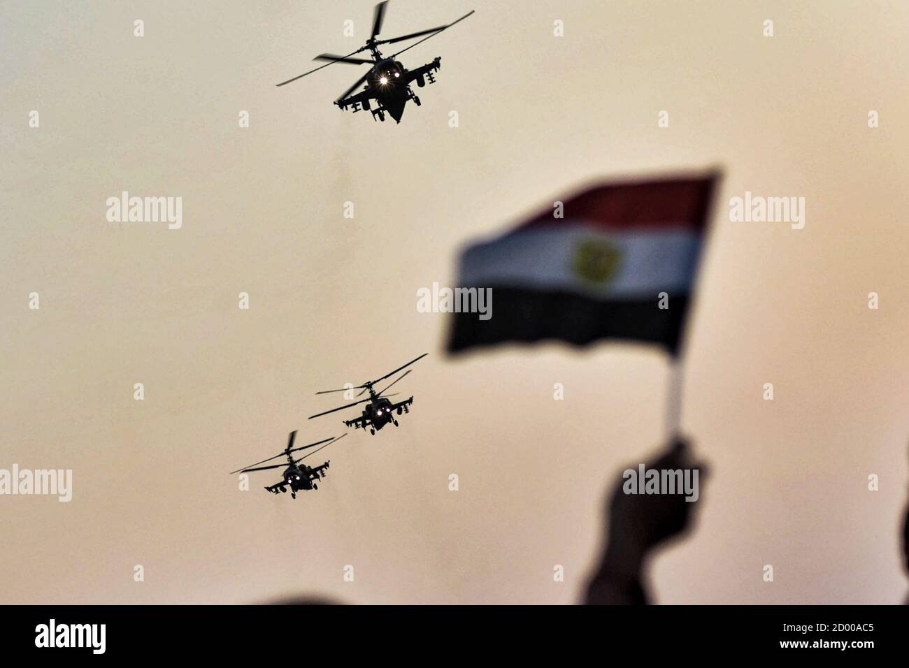Cairo, Egypt. 02nd Oct, 2020. Egyptian military helicopters fly over supporters of Egyptian President Abdel Fattah al-Sisi during a pro-government rally, held on the occasion the 6th of October war anniversary, near the Unknown Soldier Memorial. Credit: Sayed Hassan/dpa/Alamy Live News Stock Photo