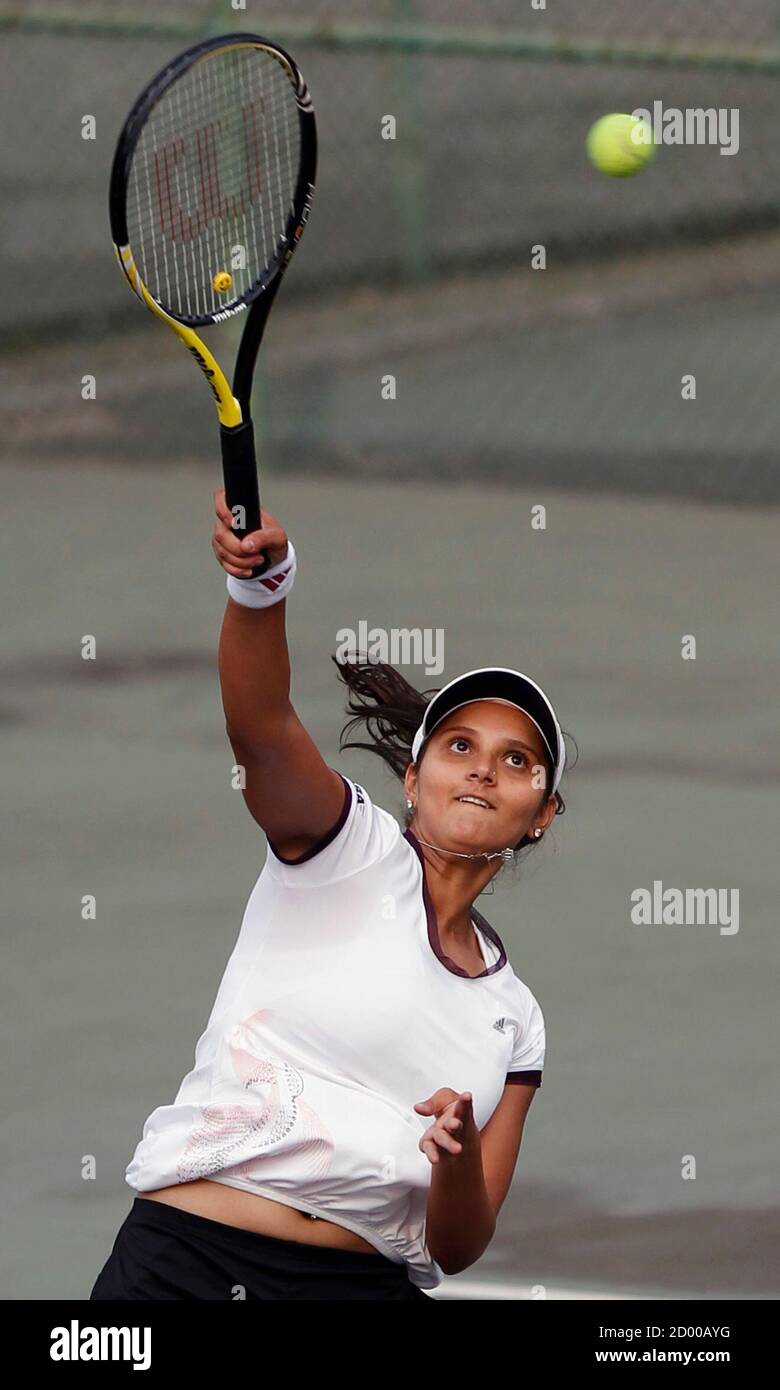 Indian tennis player Sania Mirza practices at the Bangladesh Tennis  Federation in Dhaka January 26, 2011. Mirza is accompanying her husband,  Pakistani cricketer Shoaib Malik, who is playing in the Bangladesh Premier