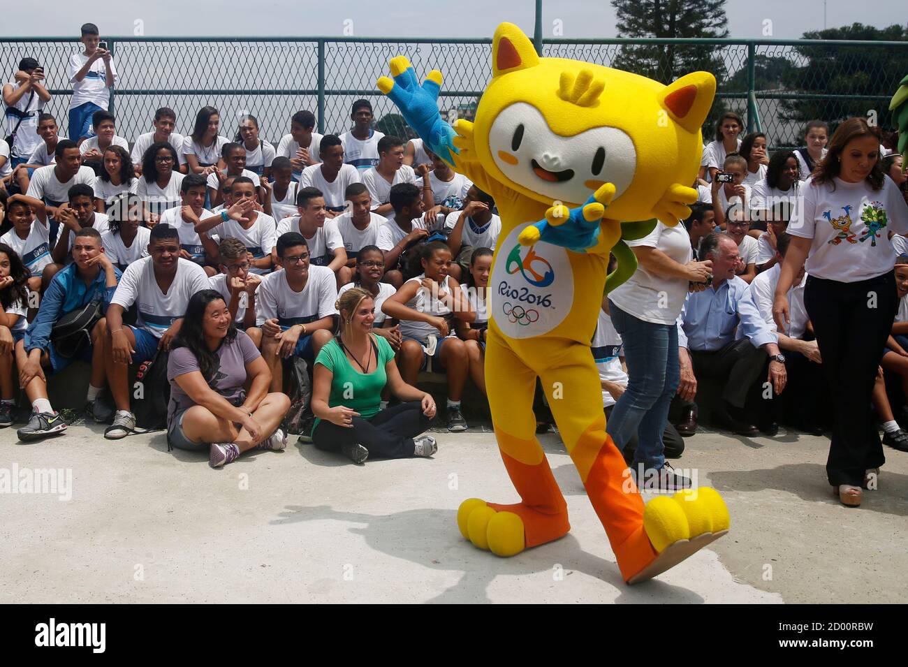 The mascot of the Rio 2016 Olympic Games is pictured during its presentation in Rio de Janeiro November 24, 2014. Bright yellow and cat-like, with a green leaf-haired brother, the mascots for the 2016 Olympics and Paralympics in Rio de Janeiro were launched by organizers late on Sunday. The mascots, who are said to represent the animals and plants of Brazil, are a key part of the Olympics merchandising campaign which is set to feature 12,000 products and is an important revenue source and a vital way of engaging the public. A public poll will be held to decide their names from a shortlist of O Stock Photo