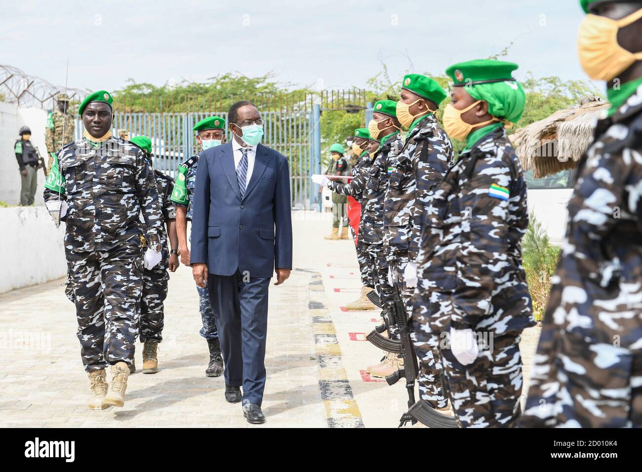 Ambassador Francisco Madeira, the Special Representative of the Chairperson of the African Union Commission (SRCC) for Somalia inspects a parade mounted by officers of the Sierra Leone Formed Police Unit, serving under the African Union Mission in Somalia (AMISOM), during a medal parade held in Mogadishu, Somalia on 6 September 2020. Stock Photo