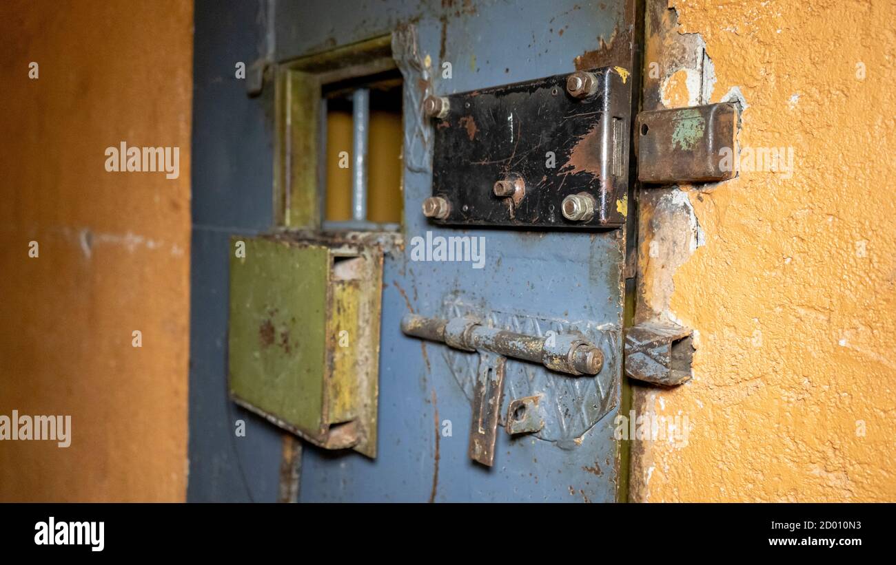 Prison's Windows of Metal Door Protect Prisoner From Inside to Escape. Food Channel Through