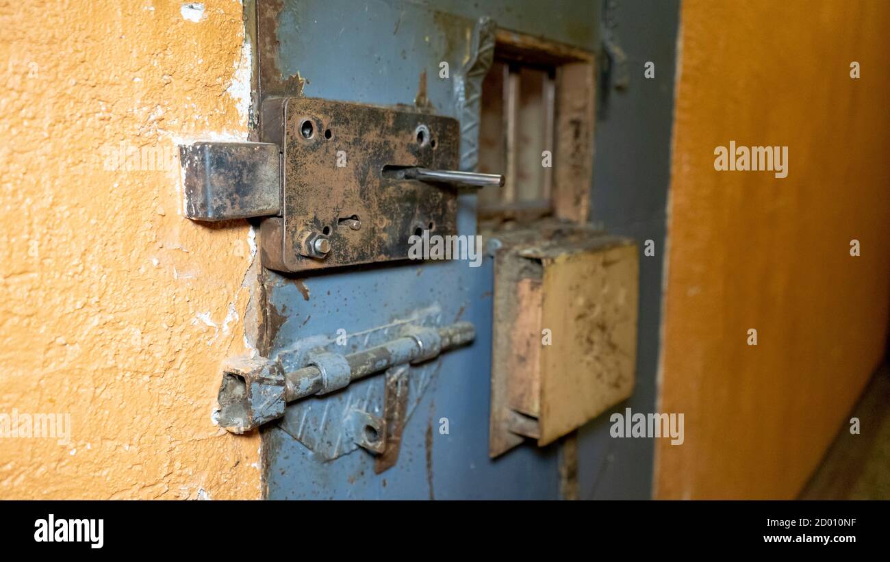 Prison's Windows of Metal Door Protect Prisoner From Inside to Escape. Food Channel Through