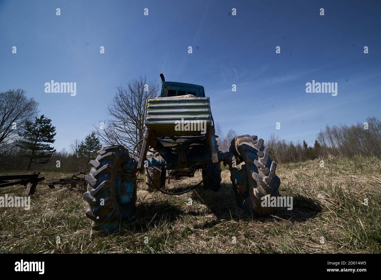old tractor on the grass field Stock Photo - Alamy