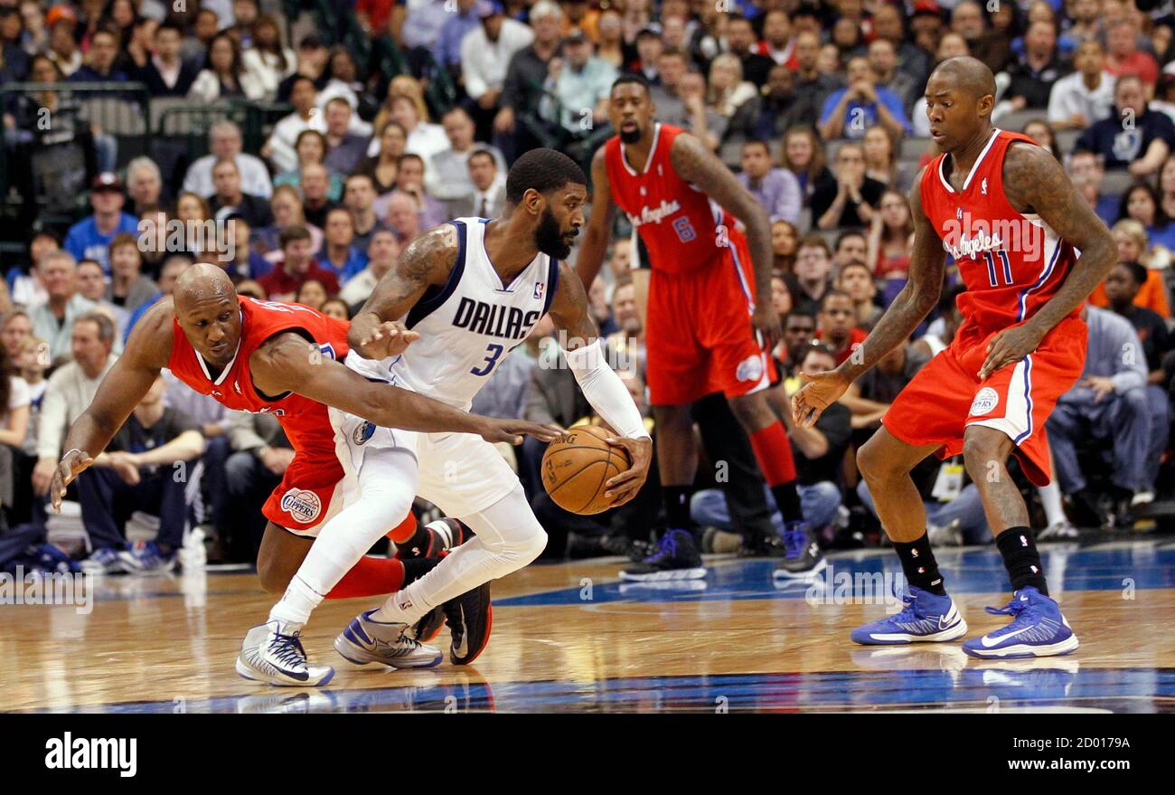 Los Angeles Clippers forward Lamar Odom (L) pressures Dallas Mavericks  guard O.J. Mayo (2nd L), as Clippers center DeAndre Jordan and guard Jamal  Crawford (R) watch, during the second half of their