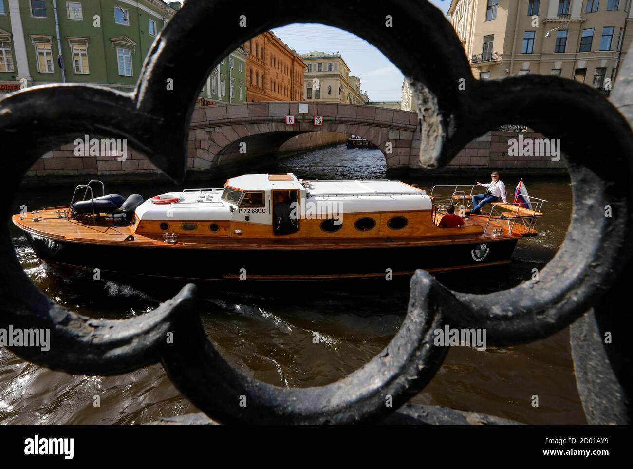 Passengers enjoy a boat ride on a canal in St. Petersburg June 5, 2014. St. Petersburg is famous as a tourist destination for its canals and pre-revolutionary architecture. REUTERS/Alexander Demianchuk (RUSSIA - Tags: TRAVEL SOCIETY) Stock Photo
