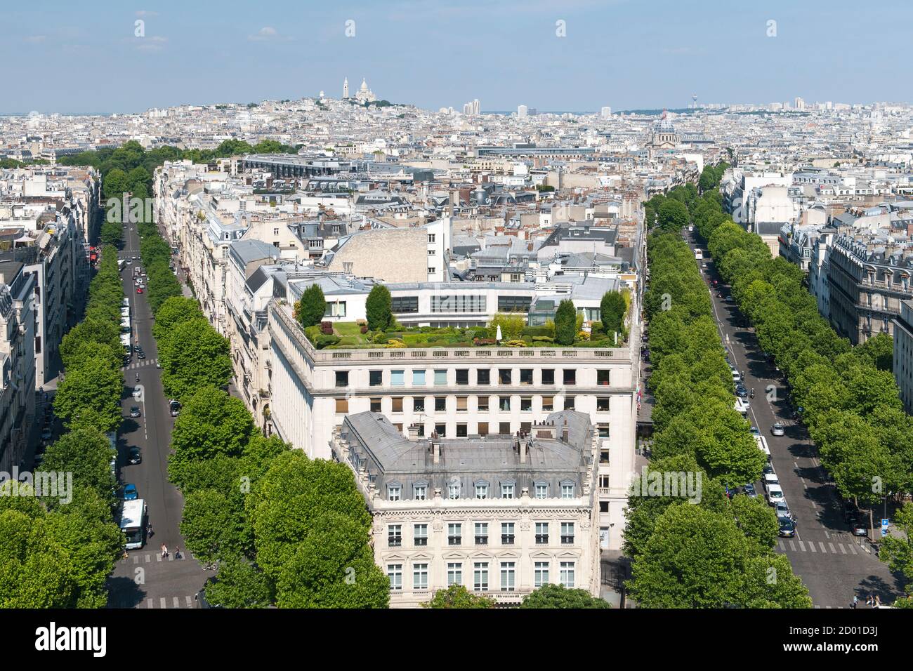 View across Paris from the top of the Arc De Triomphe. Avenue de Friedland runs on the right side and Avenue Hoche runs on the left side of the image. Stock Photo