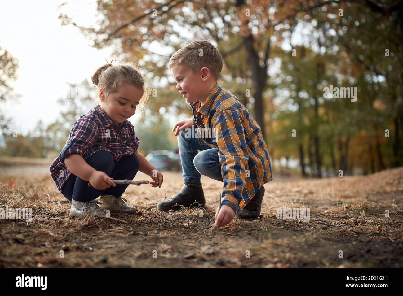 Preschool brother and sister playing in the park together Stock Photo ...