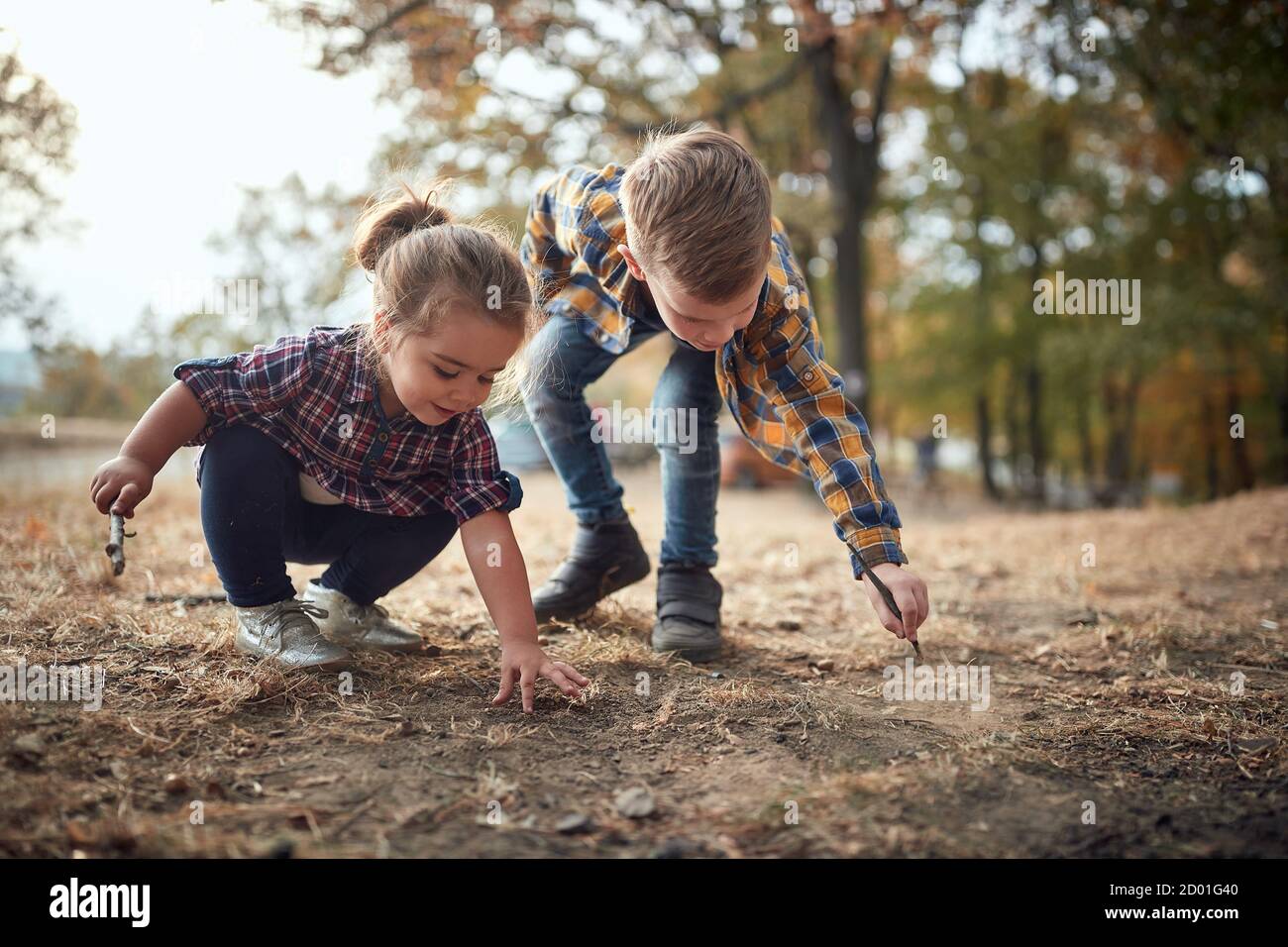 Preschool brother and sister playing in the park together Stock Photo ...