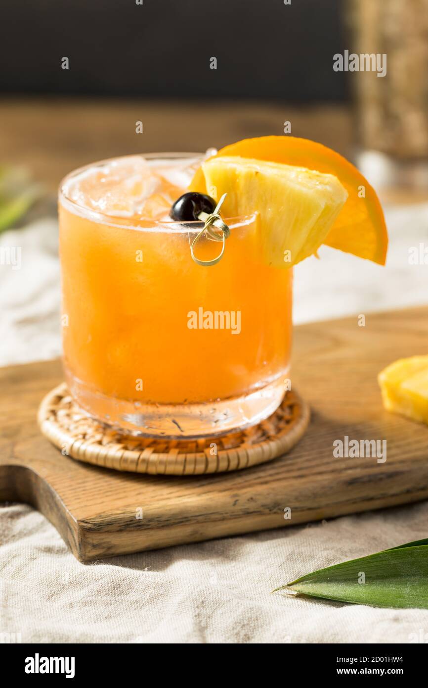 Refreshing Boozy Rum Runner Cocktail with PIneapple and Orange Stock Photo