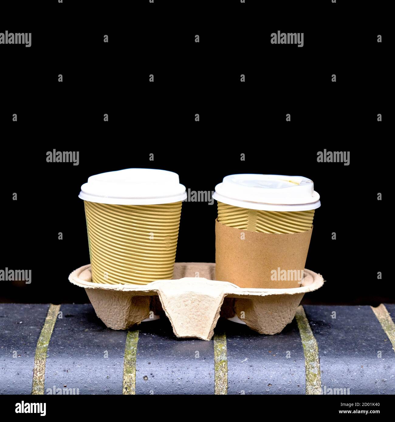 Two Brown Takeaway Cardboard Coffee Cups With Lids Left Sitting On A ...