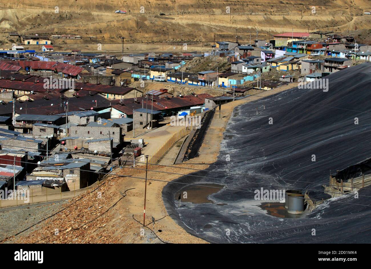 The ramshackle town of Morococha is seen next to mine tailings in the  Andean city of Junin, June 18, 2012. High in the Andes mountain range, a  Chinese mining company is now