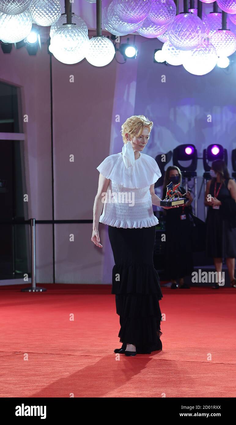 VENICE, ITALY - SEPTEMBER 02: Tilda Swinton poses the Golden Lion for Lifetime Achievement during the 77th Venice Film Festival Stock Photo