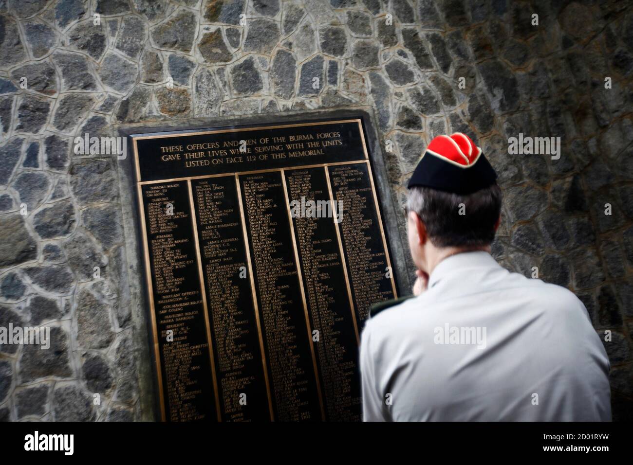 Britain's Chief of Defence Staff, General David Richards, looks at a memorial plaque bearing the names of soldiers who died in Burma, presently known as Myanmar, during World War Two, at Taukkyan war cemetery, on the outskirts of Yangon, June 4, 2013. REUTERS/Minzayar (MYANMAR - Tags: MILITARY POLITICS CONFLICT) Stock Photo