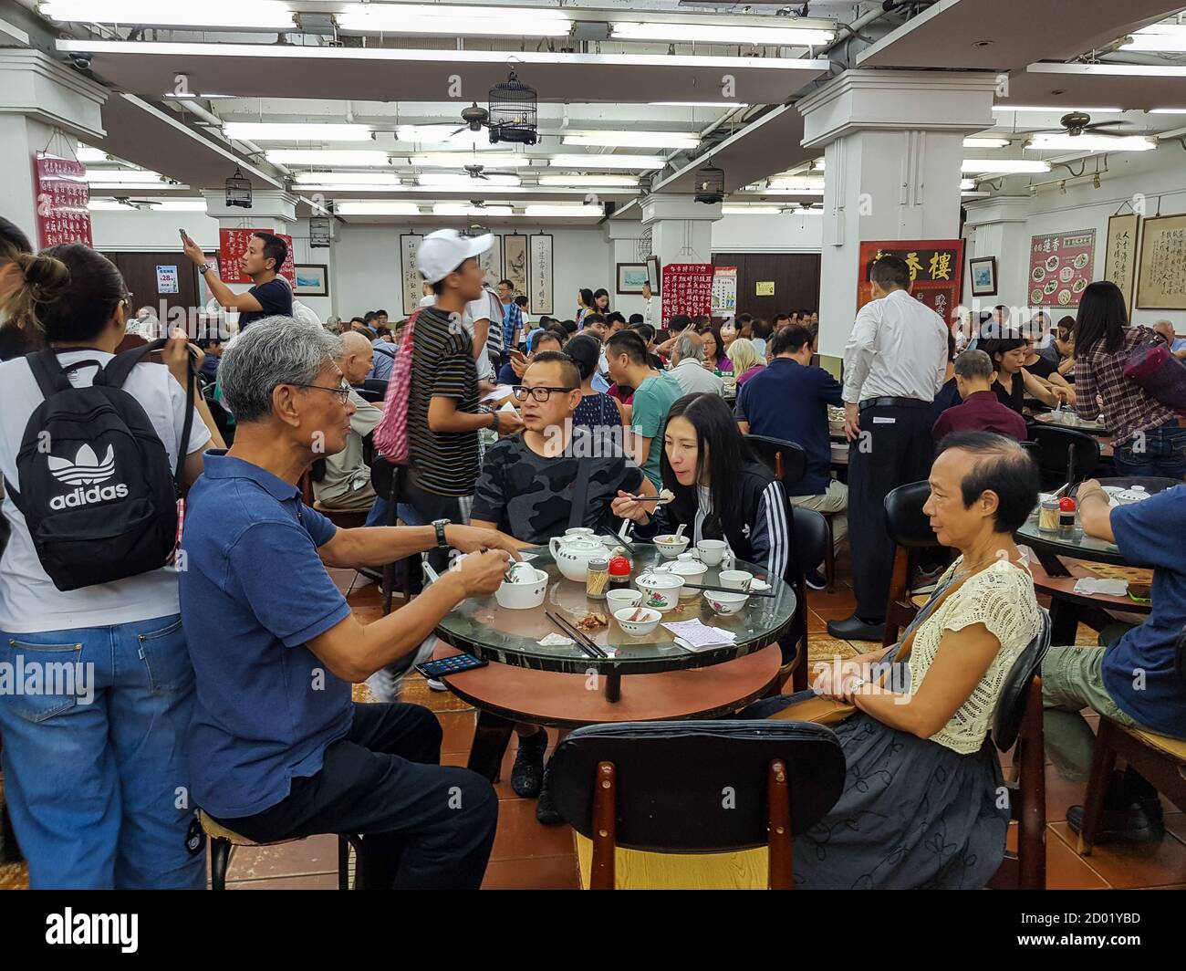 The interior of a traditional old style Dim Sum restaurant in Hong Kong which is fast