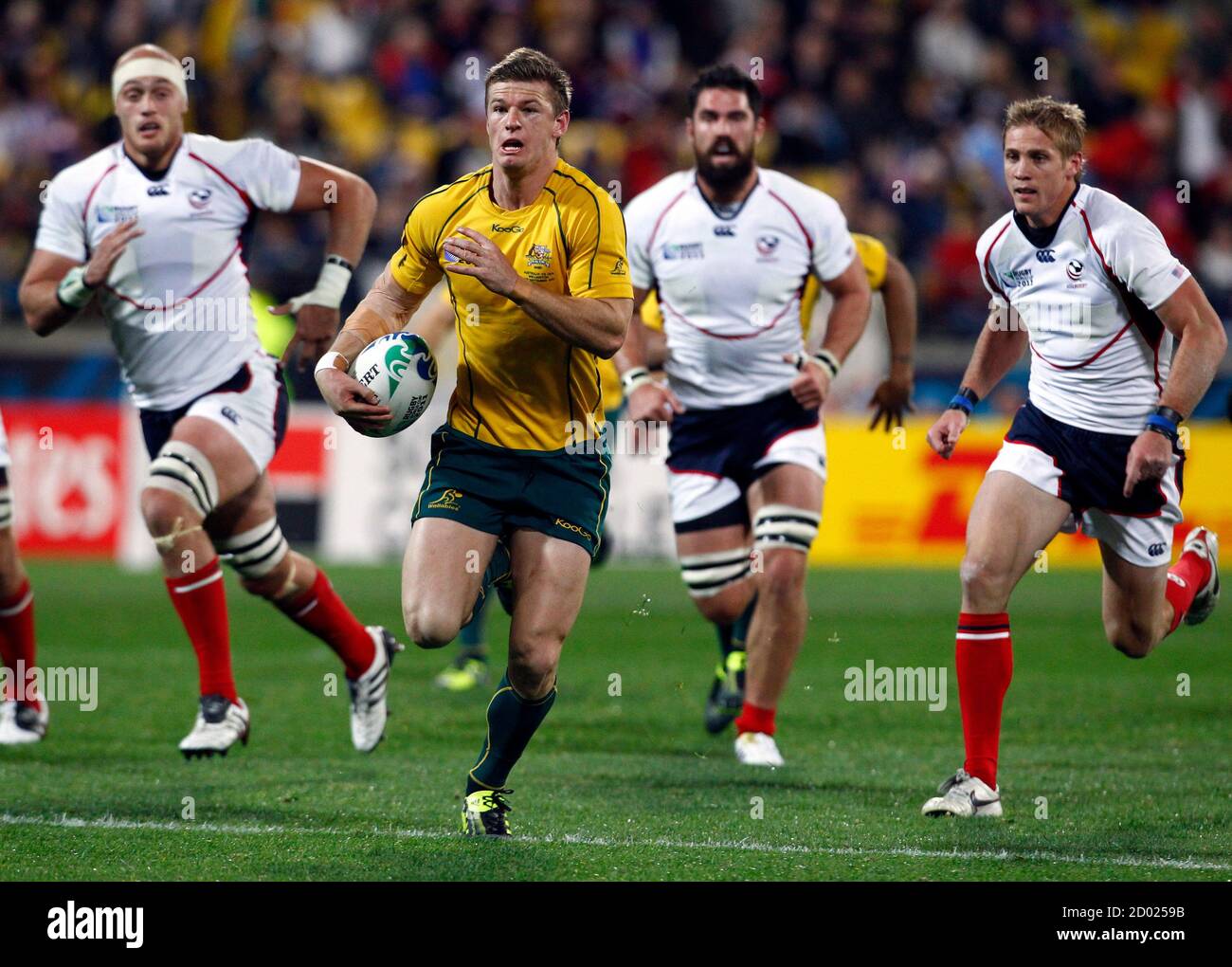 Australia Wallabies' Rob Horne runs with the ball during their Rugby World Cup Pool C match against the U.S. at Wellington Regional Stadium in Wellington September 23, 2011. REUTERS/David Gray (NEW ZEALAND  - Tags: SPORT RUGBY) Stock Photo